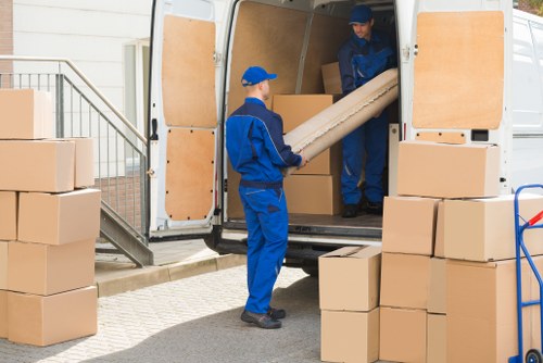 Removal team planning a move in a Millwall residential street