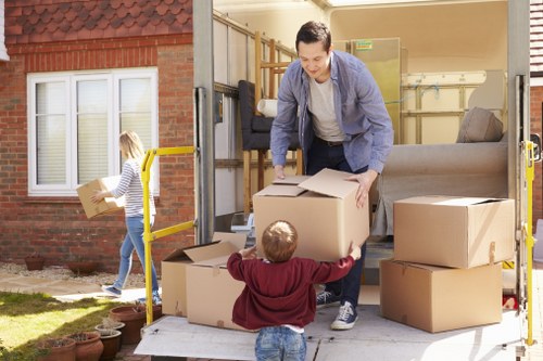 Professional packing team preparing household items for a move in Millwall