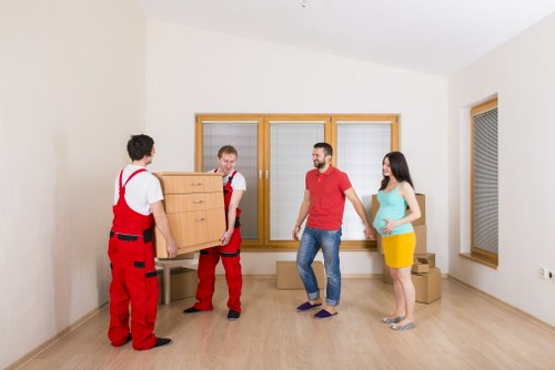 Moving team handling items carefully during a Millwall flat relocation