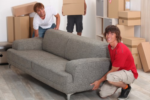 Moving day preparation with labelled boxes and furniture in Millwall